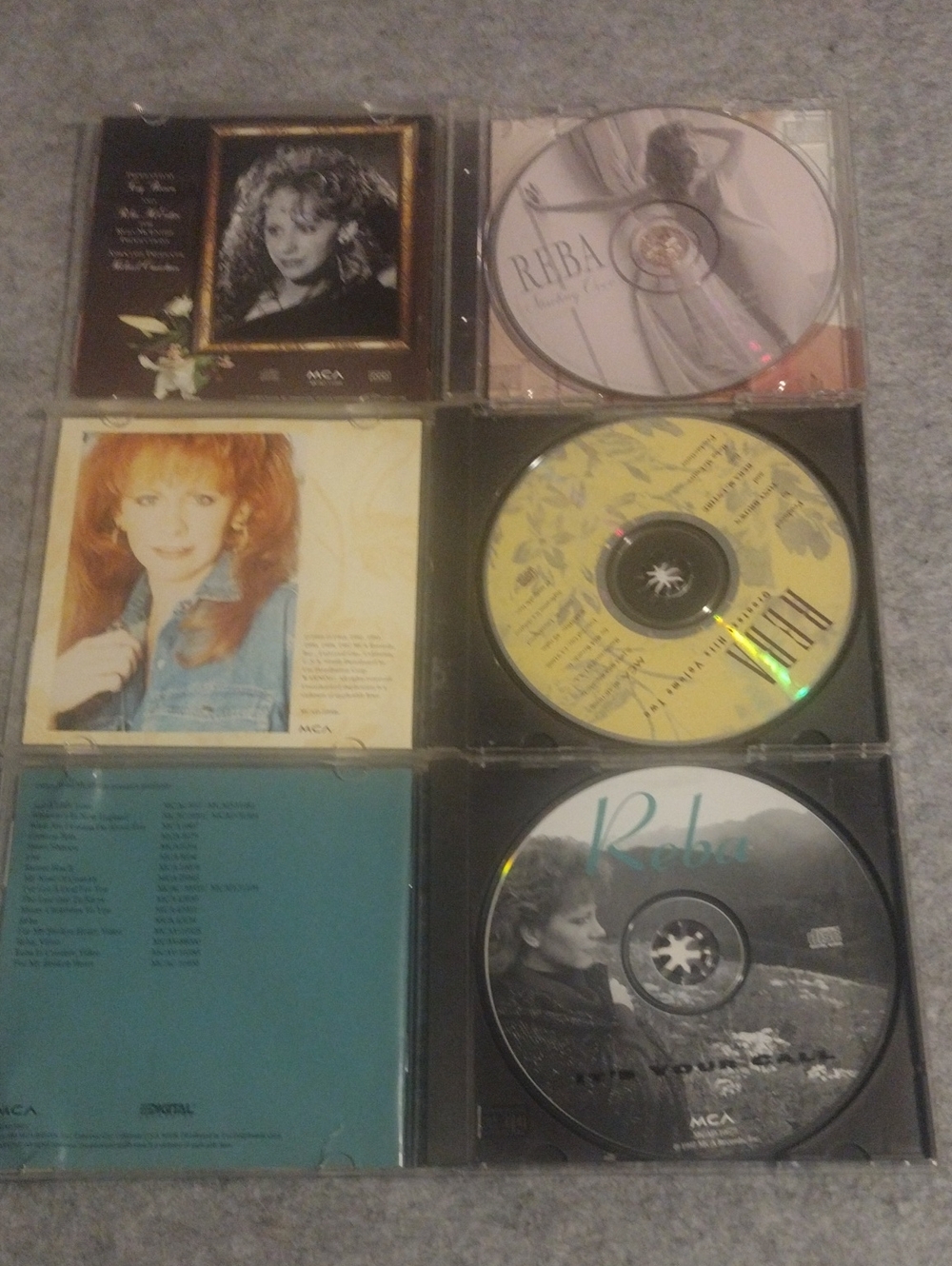 Reba CD Collection Display in Red, Cream, Yellow, Teal, Black